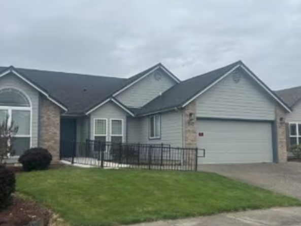 Front exterior of The Twins Home with an accessibility ramp
